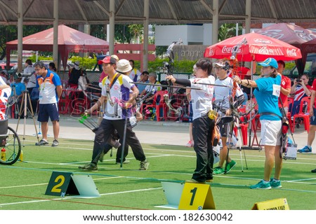 BANGKOK ,THAILAND - MARCH 15: Two teams of archers shoot out for a best point at 1st Asian Archery Grand Prix 2014 , on March 15, 2014 in Bangkok, Thailand.