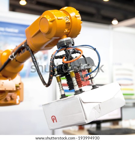 BANGKOK ,THAILAND - MAY 17: Industrial  robotic arm in ASEAN's Leading  Industrial Machinery and Subcontracting Exhibition 2014,on May 17, 2014 in  Bangkok, Thailand.