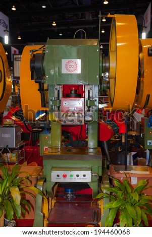 BANGKOK ,THAILAND - MAY 18:Metal stamping machine ASEAN\'s Leading Industrial Machinery and Subcontracting  Exhibition 2014,on May 18, 2014 in Bangkok, Thailand.