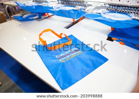 BANGKOK - JUNE 28 :Embroidery machine on bag finish in Textile Industry at  Garment Manufacturers Sourcing 2014 on June 28,2014 in BITEC ,Bangkok,  Thailand.