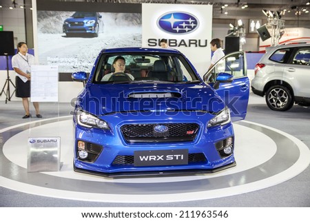BANGKOK - AUGUST 16 :Unidentified people interesting with Subaru Sport car  at Big Motor Sale 2014 on June 28,2014 in BITEC ,Bangkok, Thailand.