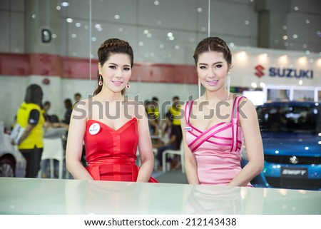 BANGKOK - AUGUST 16 :An unidentified female presenter models at Suzuki booth at Big Motor Sale 2014 on June 16,2014 in BITEC ,Bangkok, Thailand.