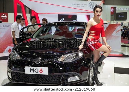 BANGKOK - AUGUST 16 :An unidentified female presenter models at MG Motor booth at Big Motor Sale 2014 on June 16,2014 in BITEC ,Bangkok, Thailand.