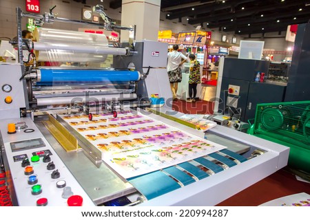 BANGKOK - SEPTEMBER 27 :Plastic coating on paper  machines display at GASMA PRINT 2014 on Sep  27,2014 in BITEC ,Bangkok, Thailand.