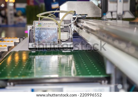 BANGKOK - SEPTEMBER 27 :Modify header of inkjet for hard  materials machines at GASMA PRINT 2014 on Sep 27,2014 in BITEC  ,Bangkok, Thailand.