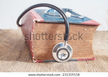 Stethoscope on old hardback books concept for medical  research
