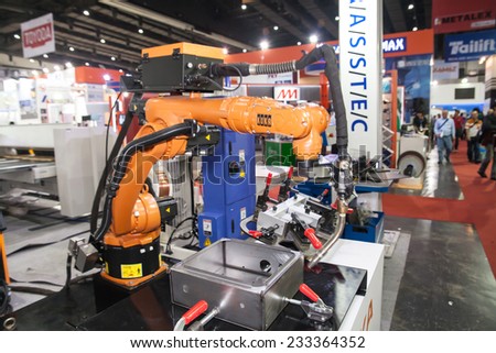 BANGKOK - SEPTEMBER 22 :robots welding in a car factory  display at METALEX 2014 on Nov 22,2014 in BITEC ,Bangkok, Thailand.