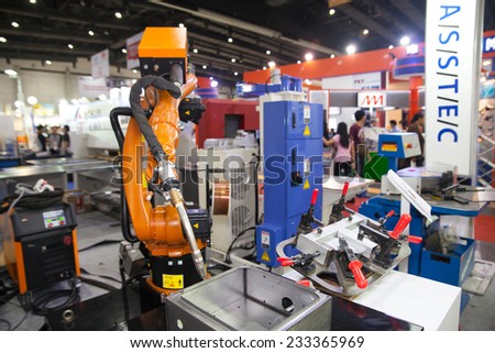 BANGKOK - SEPTEMBER 22 :robots welding in a car factory  display at METALEX 2014 on Nov 22,2014 in BITEC ,Bangkok, Thailand.