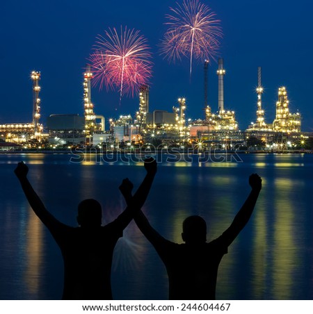 Silhouette man action with oil refinery plant against at night