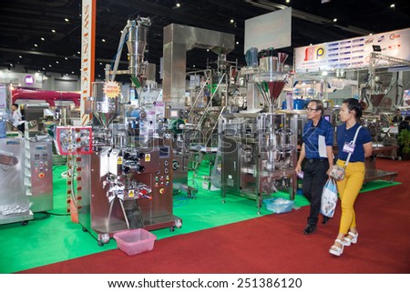 BANGKOK ,THAILAND - FEBRUARY 7: Unidentified people  interesting with food packing machine At THAILAND  Industrial Fair 2015 And Food Pack Asia 2015 on  February 7, 2015 in Bangkok, Thailand.