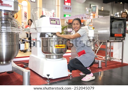 BANGKOK ,THAILAND - FEBRUARY 7: Unidentified people clean  a bakery equipment  at THAILAND Industrial Fair 2015 And  Food Pack Asia 2015 on February 7, 2015 in Bangkok, Thailand.