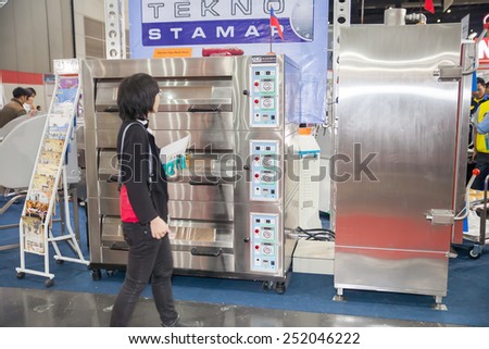 BANGKOK ,THAILAND - FEBRUARY 7: Unidentified people interest  with oven for industrial at  THAILAND Industrial Fair 2015 And Food Pack Asia 2015 on  February 7, 2015 in Bangkok, Thailand.