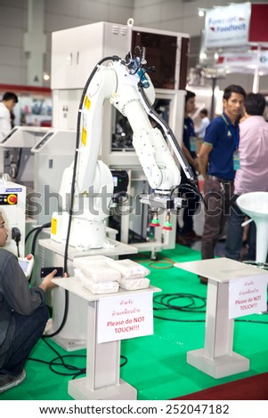 BANGKOK ,THAILAND - FEBRUARY 7: robotic hand at  THAILAND Industrial Fair 2015 And Food Pack Asia 2015 on  February 7, 2015 in Bangkok, Thailand.