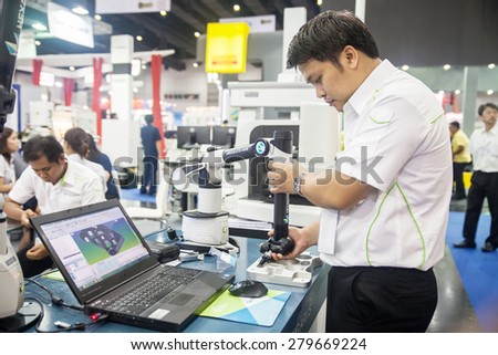 BANGKOK ,THAILAND - MAY 16: Unidentified people use Measuring  instrument for quality inspection in Intermach-Subcon Thailand  2015, on MAY 16, 2015 in Bangkok, Thailand.