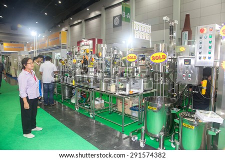 BANGKOK ,THAILAND - JUNE 20: Unidentified people interresting with \
mixing tank in PROPAK ASIA 2015, on JUNE 20, 2015 in Bangkok, \
Thailand.