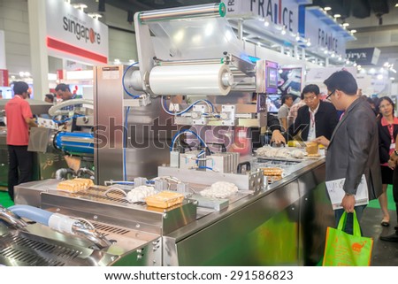 BANGKOK ,THAILAND - JUNE 20: wrapping and packing fresh food \machine in PROPAK ASIA 2015, on JUNE 20, 2015 in Bangkok, \Thailand.