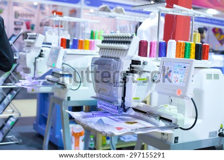 BANGKOK THAILAND JULY 11 Textile machine with colors threadsin Garment Manufacturers Sourcing Expo 2015 GFT 2015 on JULY11 2015 in Bangkok Thailand BANGKOK THAILAND JULY 11 Textile machine with colors threadsin Garment Manufacturers Sourcing Expo 2015 GFT 2015 on JULY11 2015 in Bangkok Thailand