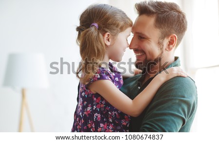 Father\'s day. Happy family daughter hugs his dad  on holiday