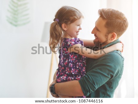 Father\'s day. Happy family daughter hugs his dad  on holiday