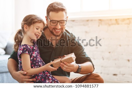 Father's day. Happy family daughterhugs his dad  on holiday