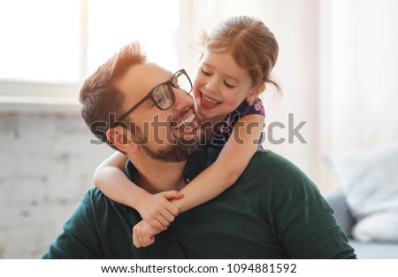 Father\'s day. Happy family daughterhugs his dad  on holiday