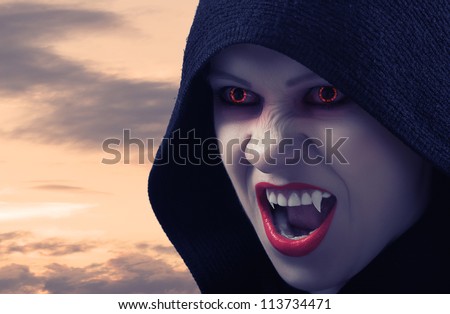 angry female vampire at sunset and moon