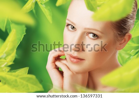 beauty woman and a natural skin care in herbal green background beauty woman and a natural skin care in herbal green background