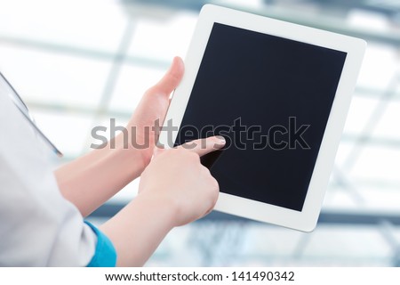blank empty computer tablet in the hands of doctor