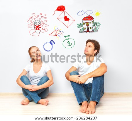 concept. young happy family couple dreaming of new house, child, financial well-being
