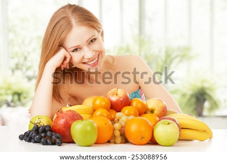happy young woman and healthy vegetarian food, fruit