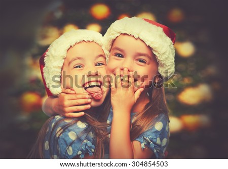 Christmas Happy funny children twins sisters hugging