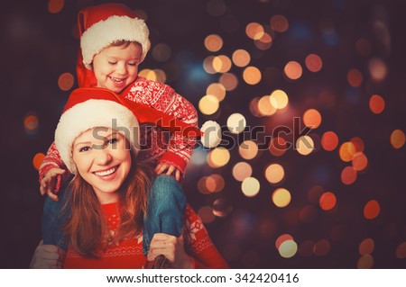 happy family mother and baby little child playing in the winter for the Christmas holidays