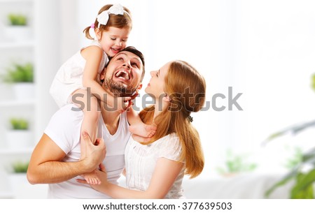 happy family mother, father,  child daughter at home