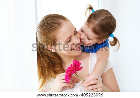 Happy loving family. mothers Day. daughter gives her mother flowers