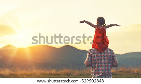 concept of family. father and child daughter outdoors in summer