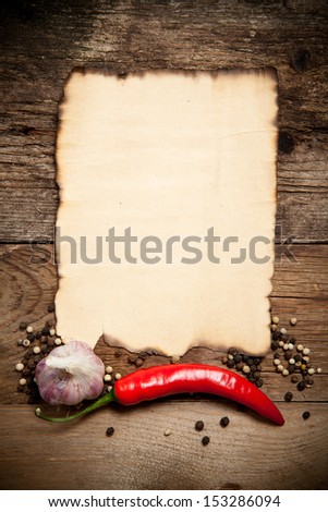 Red Hot Chili Peppers with the Old Paper sheet on old wooden table