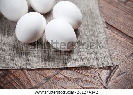 Fresh farm eggs on a wooden rustic table