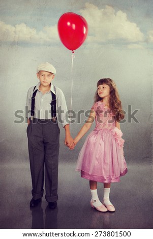 Cute children walking with a red balloon. Photo in retro style with old textured paper.