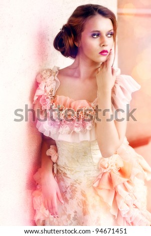 Young beautiful woman in vintage dress - stock photo