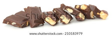 Stack of chocolate pieces with nut isolated on white background