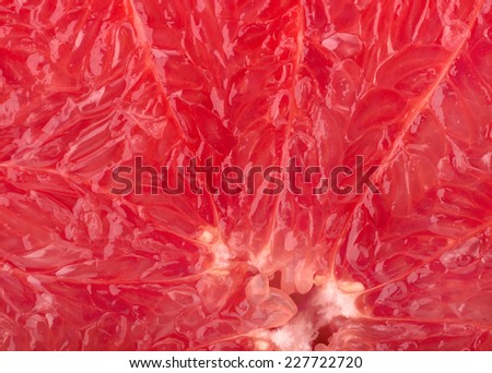 Ripe red grapefruit background close-up