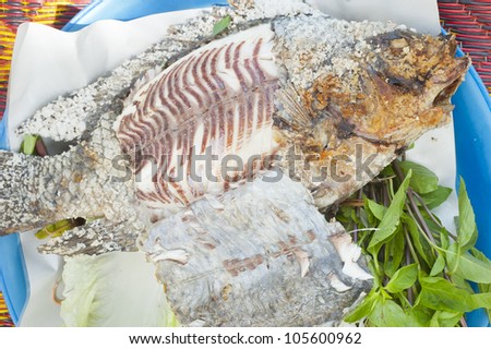 Grilled fish with vegetable on mat