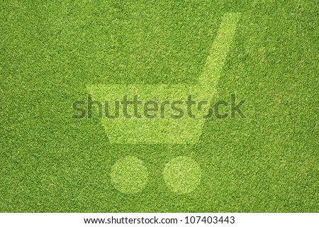 Shopping cart icon on green grass texture and  background