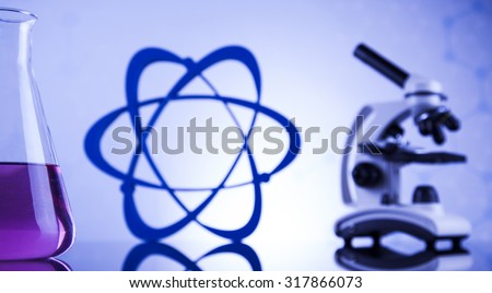 Laboratory work place with microscope and glassware