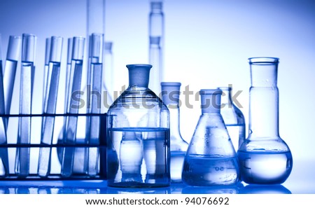 Glass laboratory equipment with blue background