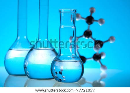 Glass laboratory equipment with blue background