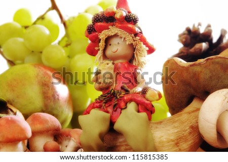 elf sitting over a boletus with grapes