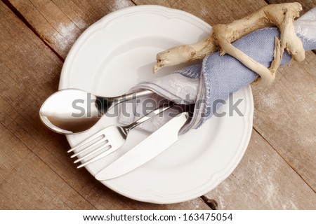 elegant cutlery with original wood napkin ring