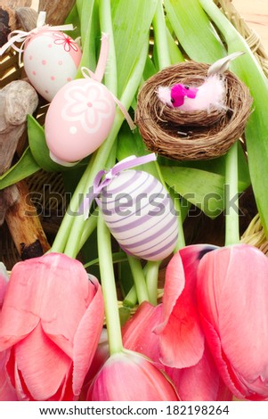 easter composition with decorative bird and eggs