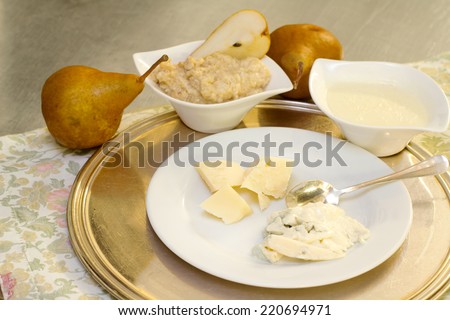 gourmet recipe with cheese selection and kaiser pear cream and fruits